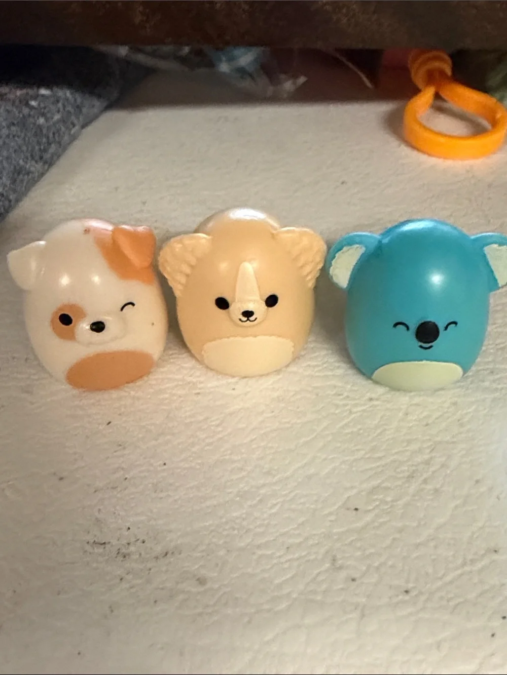 Lot of 11 small 1” collectible Squishmallows squish-a-longs & blue sun visor